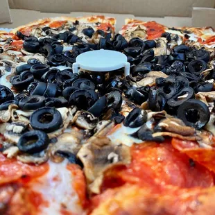 Medium Pepperoni, olive, and mushroom.