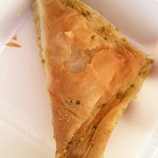 a piece of pie in a styrofoam container