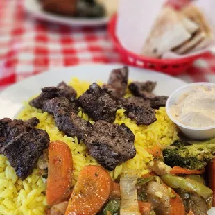 Lamb kabob with veggies and rice