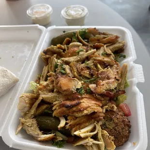 a meal in a styrofoam container