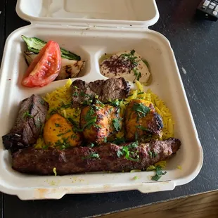 Jerusalem grill entree, tenderloin beef kabob, kefta kabob, and chicken breast kabob, served with rice and hummus