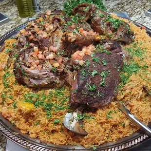 whole lamb on top of rice