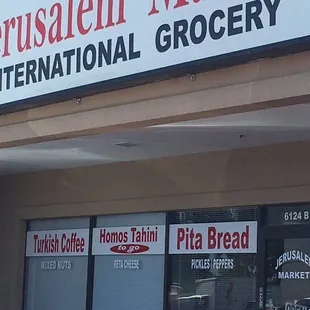 a red car parked in front of the store