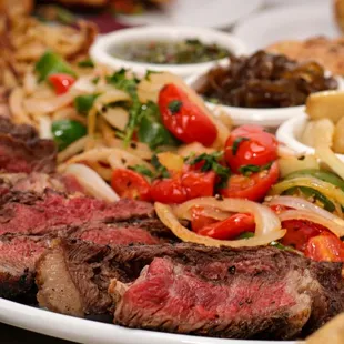 steak, pasta, and vegetables