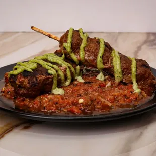 meat skewers on a plate