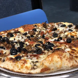 Build your own vegan pizza with vegan sausage, mushrooms, black olives and vegan pepperoni.