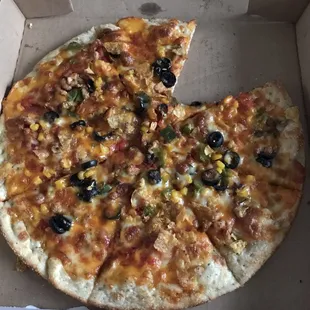 Mexican pizza . The pizza has nachos on it what more could you ask for .