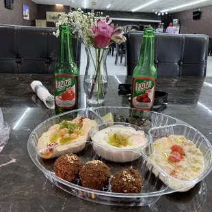 JERUSALEM APPETIZER PLATTER....... Falafel (3 Piece), Grape Leaves (2 Pieces), Hummus, Baba Ghanouj and pickle mix.