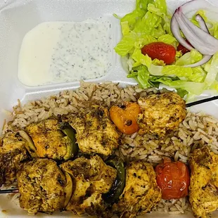 Shish tawook with tzatziki/garlic sauces, salad and rice