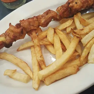 Baby chicken kebab and fries