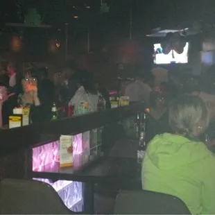 a crowd of people at a bar