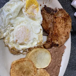Pork chop and eggs  breakfast