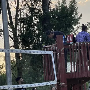 a group of people playing volleyball