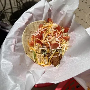 a taco in a basket on a table