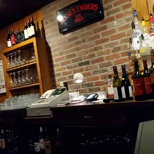 a bar with a brick wall