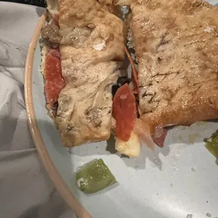Back of Calzone Raw dough original and replacement Raw!