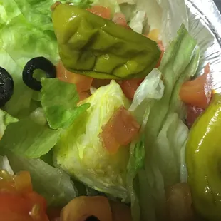 Old rotten banana peppers and scrap lettuce