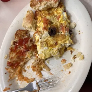 Greek omelet with hash browns and biscuit