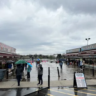 people walking in the rain