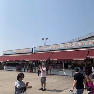 people walking in front of the restaurant