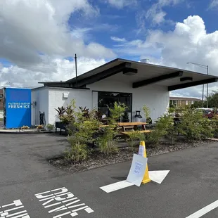 Rear - some outdoor seating and a drive-thru that&apos;s coming soon.