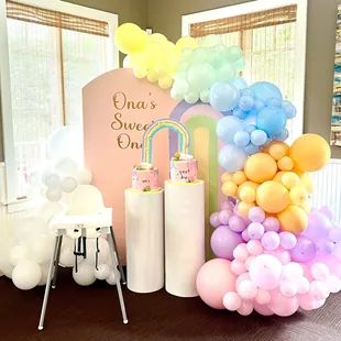 Rainbow cakes w/ balloon decor provided by Jesskakes