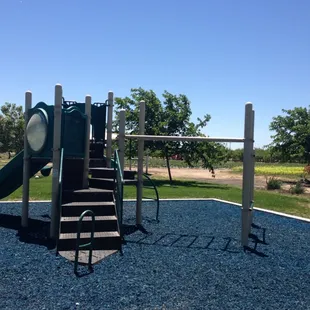 Play yard with strawberry field in the back