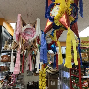 a bunch of balloons hanging from the ceiling