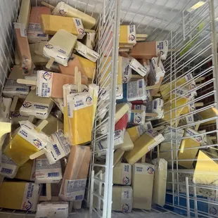 boxes of cheese in a wire rack