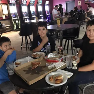 a family eating pizza