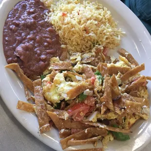 Chilaquiles. Tortilla strips, eggs, veggies, &amp; cheese. Yummy!