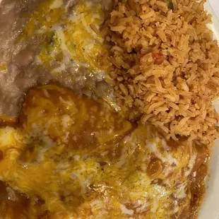 Chicken enchiladas with rice and beans