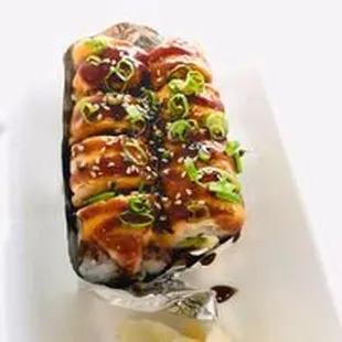 a piece of sushi on a white plate