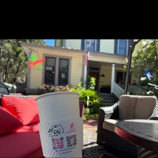 a coffee cup on a patio table