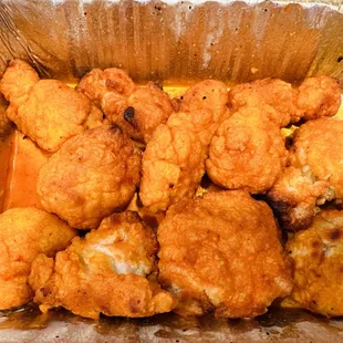 fried chicken in a foil container