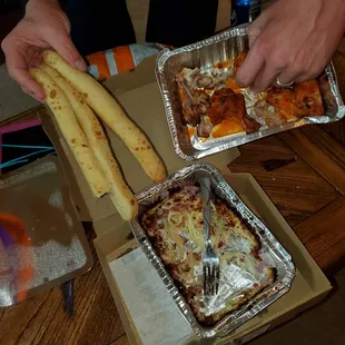 Chicken wings burned into the pan, cheesy bread with no cheese, pasta burned around edges. Good flavor though.