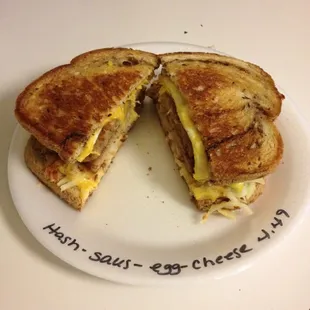 Hash browns, sausage, eggs and cheese breakfast sandwich.