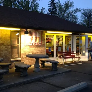 a woman walking past a restaurant