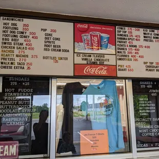 menus and prices on the side of the building