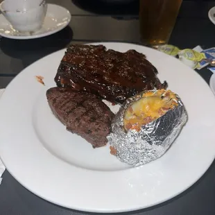 Sirloin and ribs with a loaded baked potato