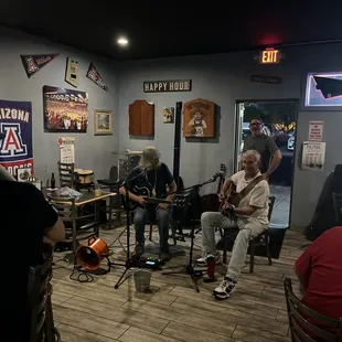 a group of people playing guitar