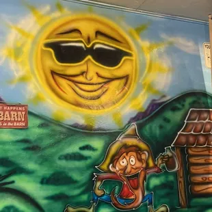 a mural of a man in a cowboy hat
