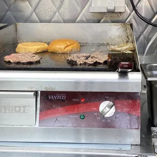 Burgers being cooked