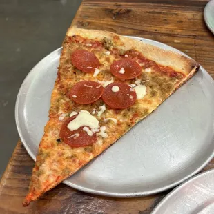 "Pepperoni" all though it is a sausage slice with pepperoni thrown on top