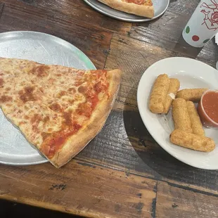 Two slices of Cheese Pizza; Crispy crust and fresh out of the oven! Homemade Mozzarella sticks and comes with a side of marinara