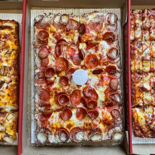 three pizzas in a box