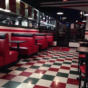 red booths and checkered floor