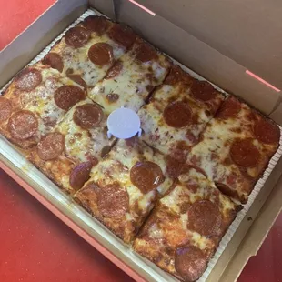 a pepperoni pizza in a box