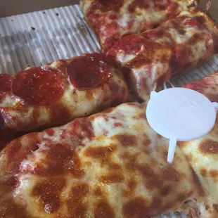 pepperoni and cheese pizza in a box