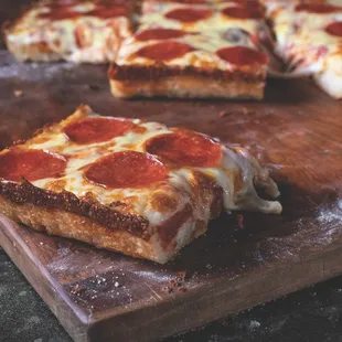 a slice of pepperoni pizza